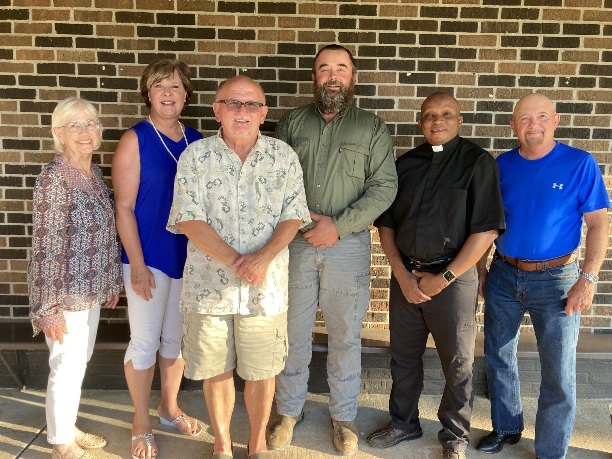 From left, Julie McDevitt; Cathy Kliethermes; Bill Allen, Vice-Chair; Tom Irwin, Chair; Father Cal; and, Deacon Chet Zuck. Not pictured, Jay Harms.